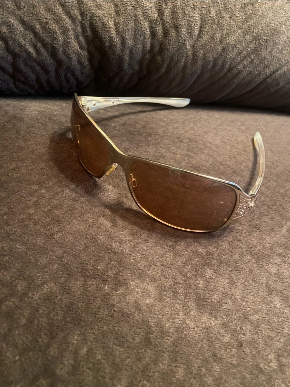 Oakley Silver Frame Sunglasses with Brown Lenses